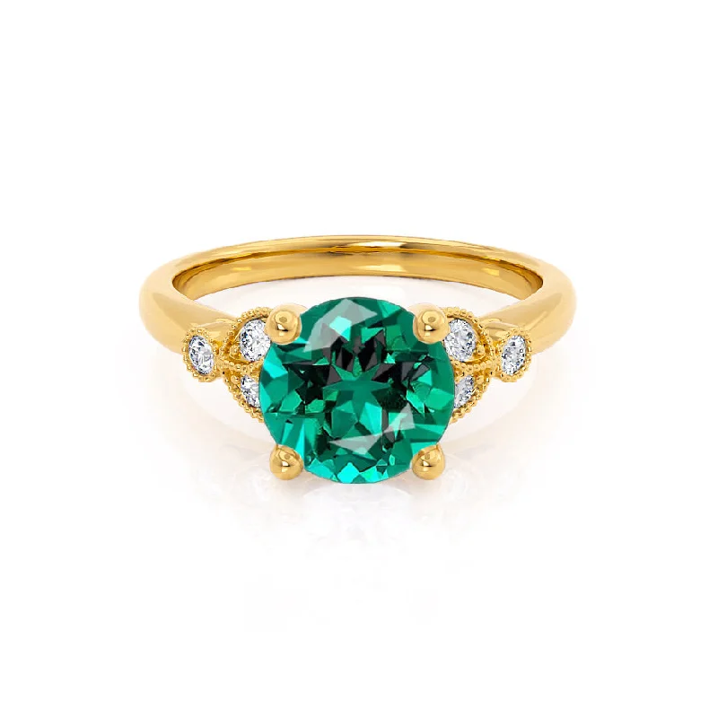 DELILAH - Chatham® Round Emerald 18k Yellow Gold Shoulder Set Ring